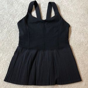 Lululemon black tank with ruffle at bottom.